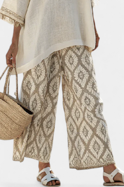 Σύνολο Boho Chic Daisy: Μακριά Μπλούζα και Εκτυπωμένα Παντελόνια για Μοναδικό Στυλ